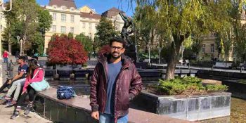 shobhit jayaswal standing outside the campus of lviv national medical university on a sunny day in the month of October 2019