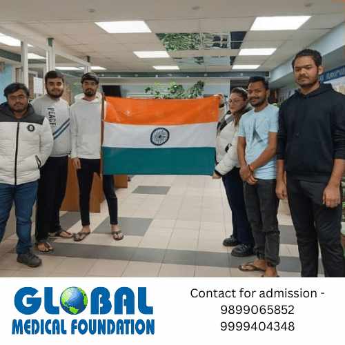 Indian students at Northern State Medical University with the flag of India.